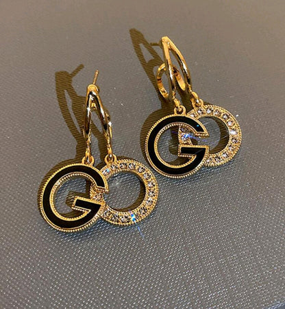 G dangle earrings